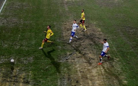 The FA Cup match was played on a less than impressive surface that resembled more of a beach than football pitch - Credit: Action Images