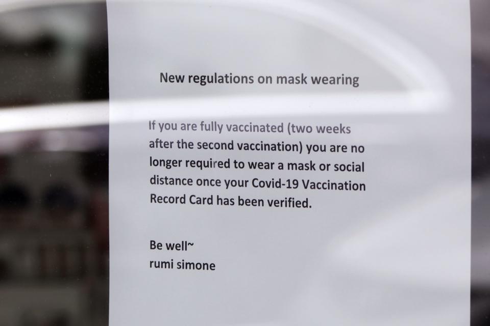 A sign at a spa and beauty salon in Lake Oswego, Oregon on Friday, May 21, 2021, advises that only customers who can prove they are fully vaccinated may enter without masks on.