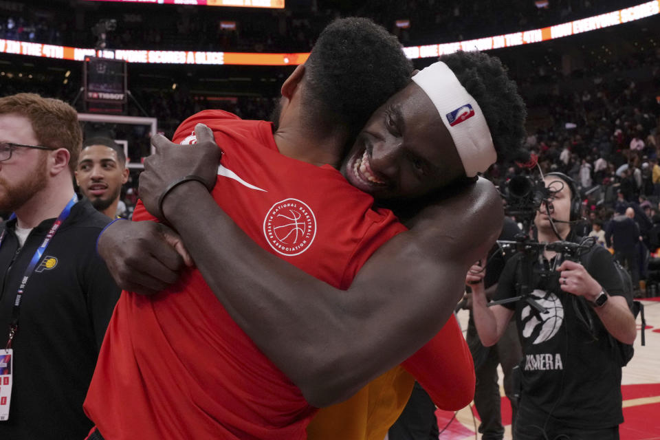 Indiana Pacers' Pascal Siakam, right, hugs Toronto Raptors' Garrett Temple following an NBA basketball game Wednesday, Feb. 14, 2024, in Toronto. (Chris Young/The Canadian Press via AP)