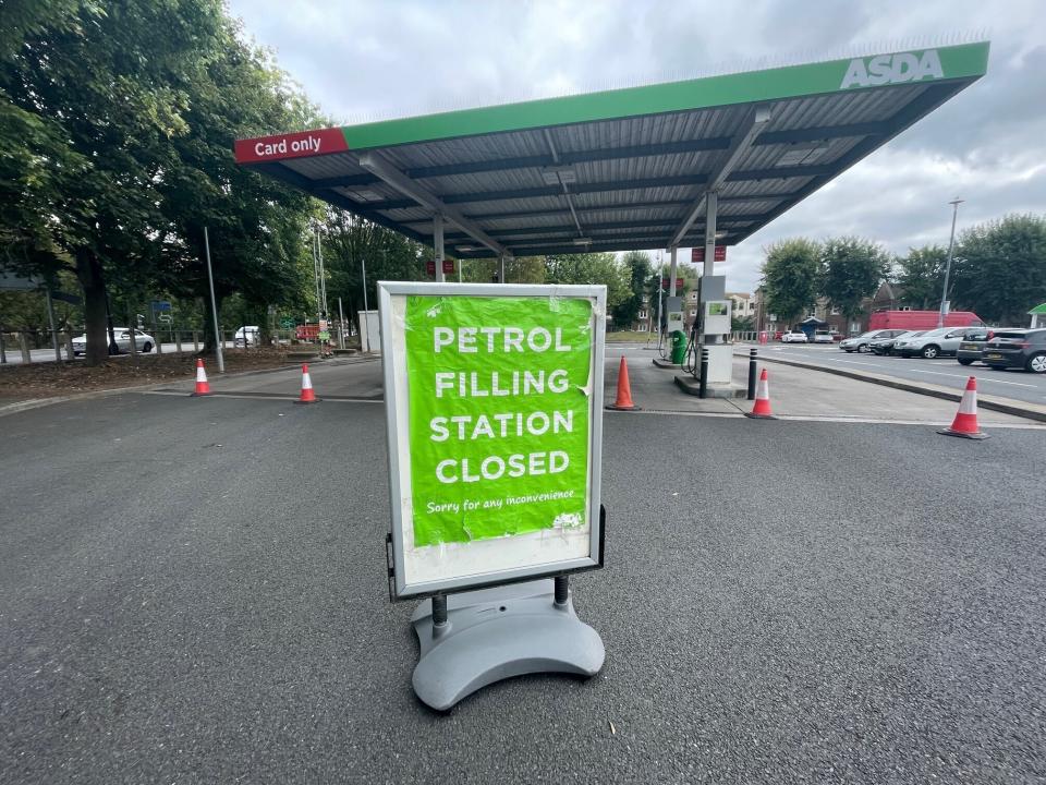 A closed petrol station in Bristol, England, Saturday Sept. 25, 2021. The haulage industry says the U.K. is short tens of thousands of truckers, due to a perfect storm of factors including the coronavirus pandemic, an aging workforce and an exodus of European Union workers following Britain’s departure from the bloc. BP and Esso shut a handful of their gas stations this week, and motorists have formed long lines as they try to fill up in case of further disruption. (Ben Birchall/PA via AP)