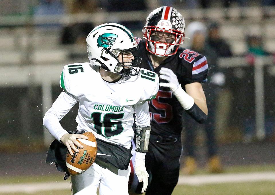 Crestview High School's Owen Barker (25) forces Columbia High School's Carter Kalamasz (16) out of the pocket during their OHSAA Division VI regional semifinal high school football game at Medina High School's Ken Dukes Stadium Saturday, Nov. 12, 2022. TOM E. PUSKAR/ASHLAND TIMES-GAZETTE