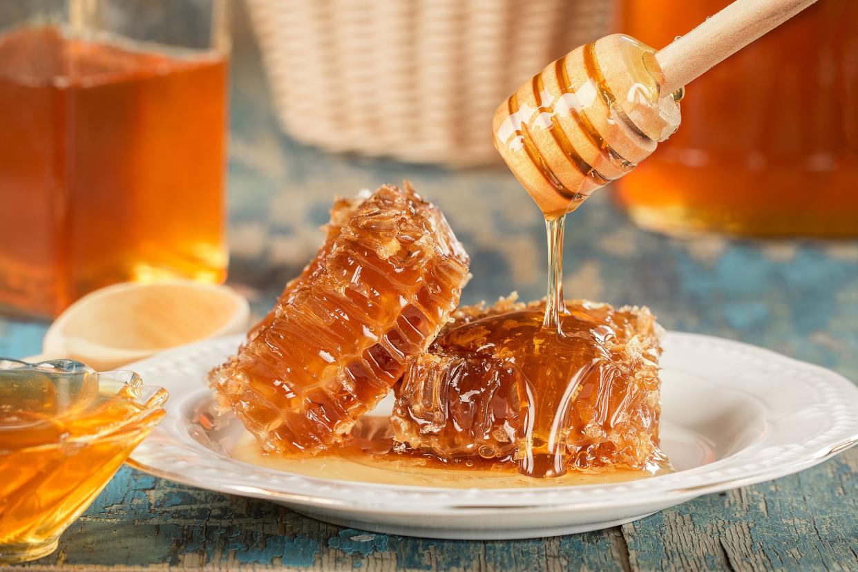 Raw honeycomb on a white plate.