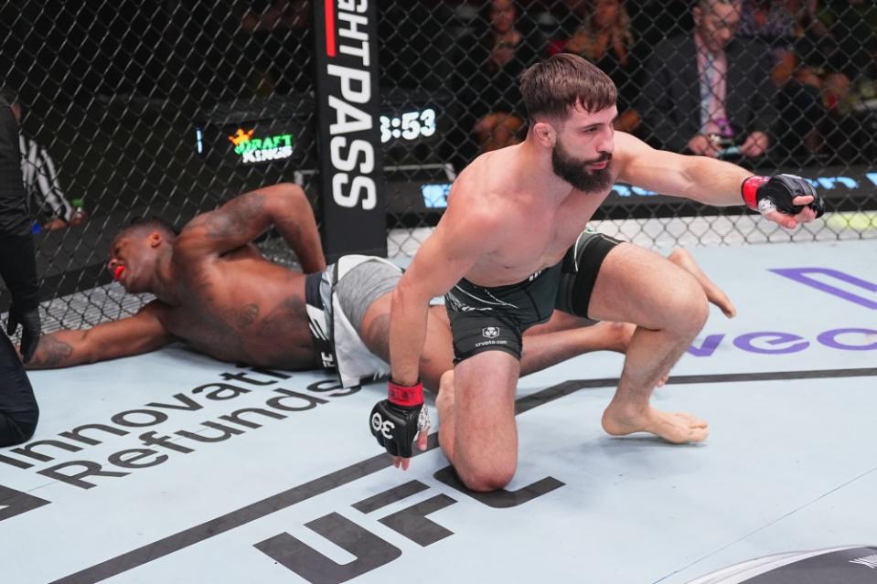 LAS VEGAS, NEVADA – JULY 15: (R-L) Nazim Sadykhov of Russia reacts after his submission victory over Terrance McKinney in their featherweight fight during the UFC Fight Night at UFC APEX on July 15, 2023 in Las Vegas, Nevada. (Photo by Jeff Bottari/Zuffa LLC via Getty Images)
