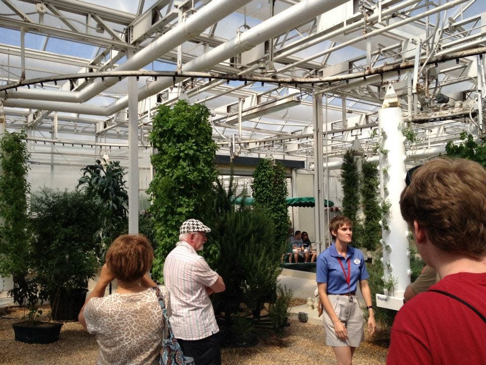 people taking the behind the seeds tour at living with the land in epcot 