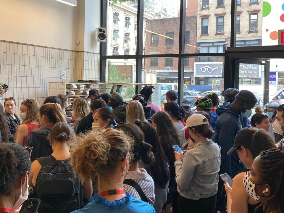 A Sweetgreen in Midtown, Manhattan crowded with customers and delivery drivers during GrubHub's free lunch promotion on Tuesday.