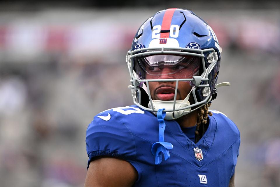 EAST RUTHERFORD, NEW JERSEY - DECEMBER 31: Eric Gray #20 of the New York Giants looks on prior to a game against the Los Angeles Rams at MetLife Stadium on December 31, 2023 in East Rutherford, New Jersey. (Photo by Mike Lawrence/Getty Images)