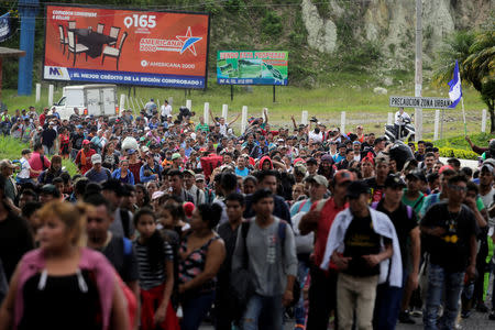 Honduran migrants, part of a caravan trying to reach the U.S., are seen during a new leg of their travel in Esquipulas, Guatemala October 16, 2018. REUTERS/Jorge Cabrera