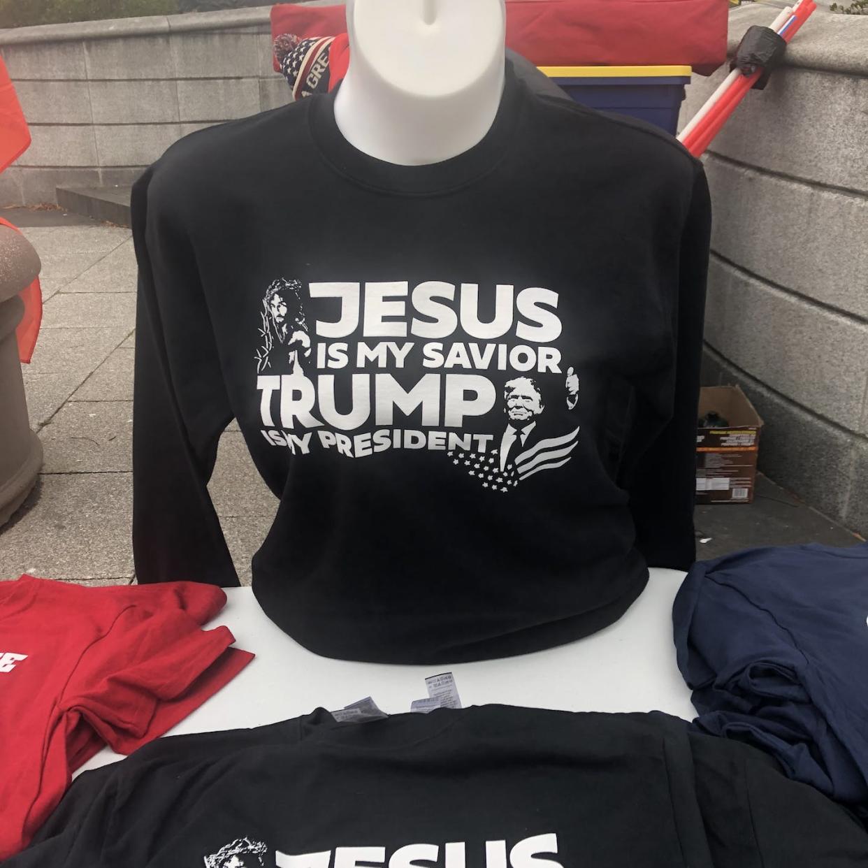 Shirts for sale on Jan. 6, 2021, combined loyalty to Jesus and to Donald Trump. Joyce Dalsheim, <a href="http://creativecommons.org/licenses/by-nd/4.0/" rel="nofollow noopener" target="_blank" data-ylk="slk:CC BY-ND;elm:context_link;itc:0;sec:content-canvas" class="link ">CC BY-ND</a>