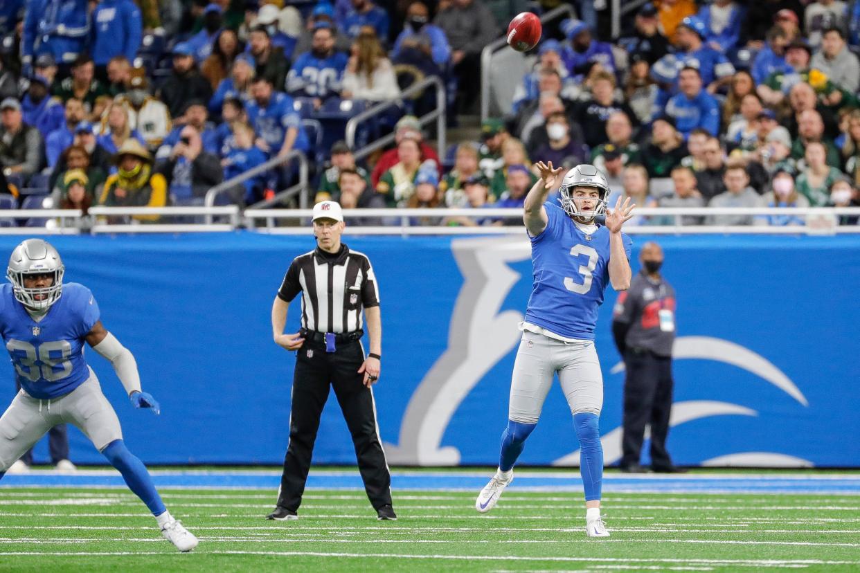 Lions punter Jack Fox throws a pass on a fake punt against the Packers during the first half on Sunday, Jan. 9, 2022, at Ford Field.