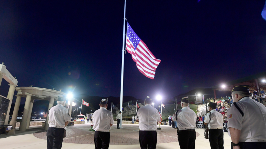 The American flag is lowered to half staff during a vigil on the eve of the first anniversary for the 13 U.S. Marines killed in an attack at the Kabul International Airport at George A. Ingalls Memorial Plaza in Norco Thursday Aug. 25, 2022.