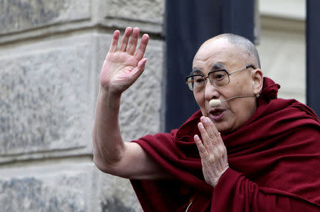 Tibet's exiled spiritual leader the Dalai Lama waves at his supporters during his visit in Prague, Czech Republic, October 17, 2016. REUTERS/David W Cerny