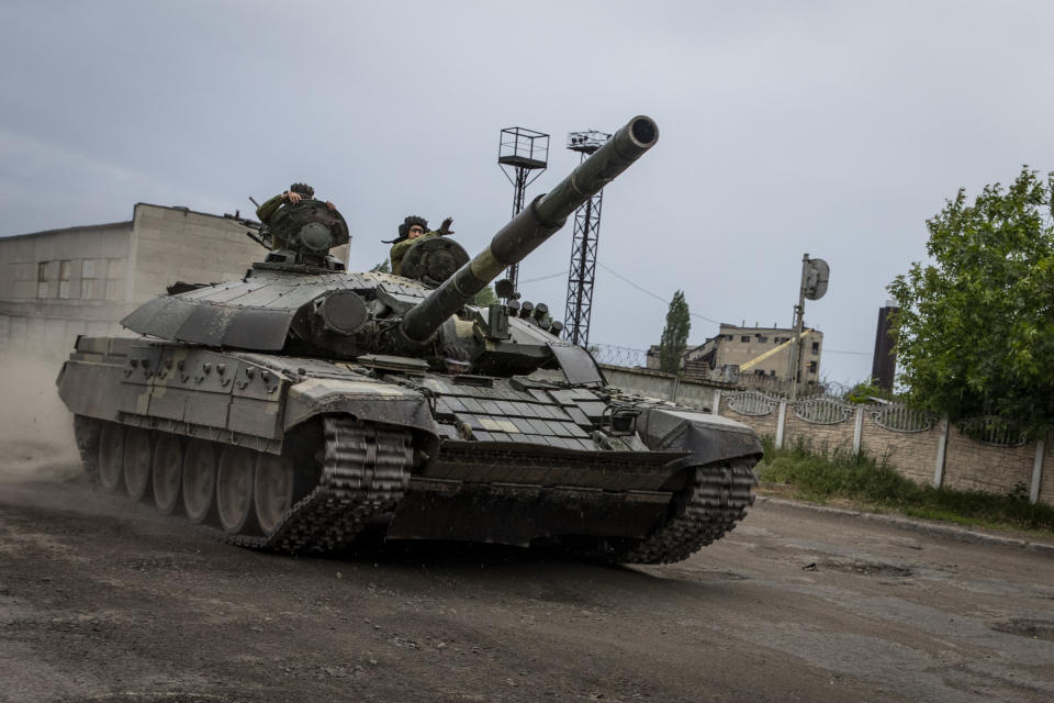 LYSYCHANSK, UKRAINE - 2022/05/26: A Ukrainian tank moves through the streets of Lysychansk. As Russian troops launch the offensive from multiple directions, hoping to cut off Ukrainian supplies and reinforcements and gain full control of the Luhansk Oblast, the town of Lysychansk connecting to Severodoonetsk is heavily bombarded and sieged. (Photo by Alex Chan Tsz Yuk/SOPA Images/LightRocket via Getty Images)