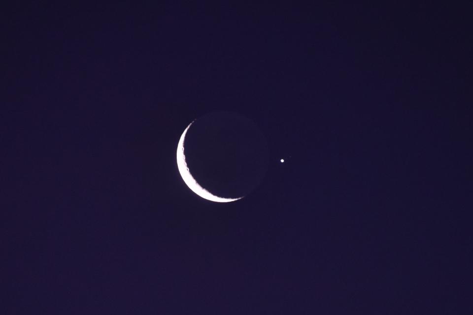 Picture of the waxing crescent moon in conjunction with planet Jupiter, seen from Montevideo after sunset on February 22, 2023. (Photo by Mariana SUAREZ / AFP) (Photo by MARIANA SUAREZ/AFP via Getty Images)