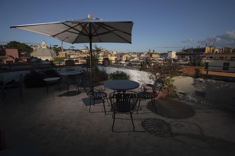 This Monday, May 11, 2020 photo shows the empty rooftop terrace of the art-deco style Locarno Hotel, in Rome, Monday, May 11, 2020. (AP Photo/Alessandra Tarantino)