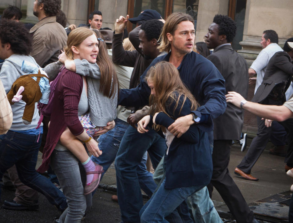 A man rushes a group of people out of the street