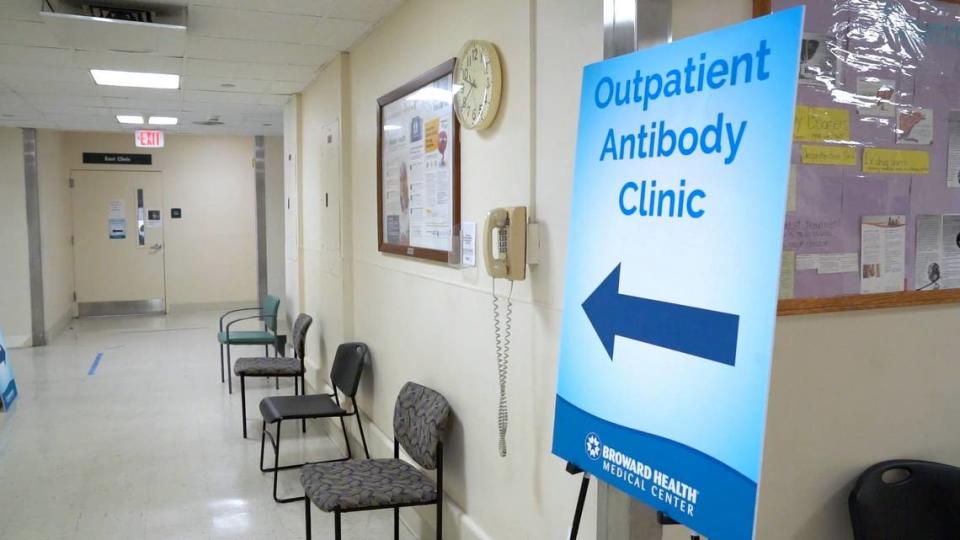 Signs direct people to Broward Health’s outpatient monoclonal antibody treatment site.