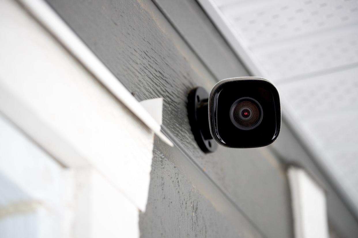 Black cctv outside the building, home security system