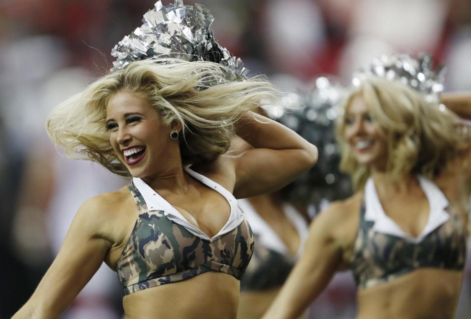 <p>Atlanta Falcons cheerleaders wearing Salute to Service costumes perform during the first of an NFL football game between the Atlanta Falcons and the Arizona Cardinals, Sunday, Nov. 27, 2016, in Atlanta.(AP Photo/John Bazemore) </p>