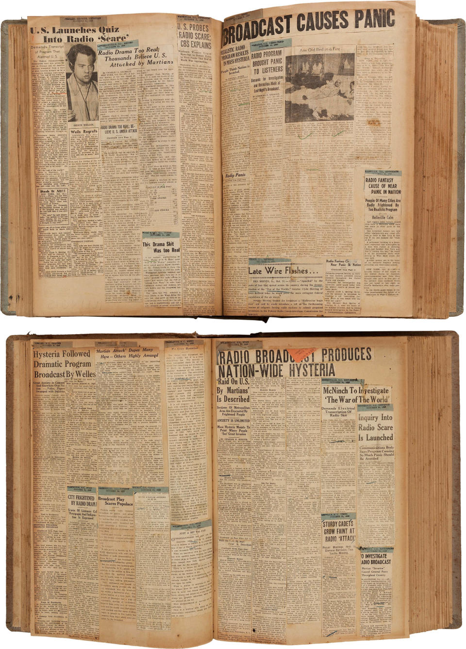 FILE - This undated file photo provided by Heritage Auctions shows two scrapbooks filled with newspaper clippings about the nationwide panic from Orson Welles' 1938 radio broadcast of "War of the Worlds". The clippings were among the legendary actor, director and scriptwriter's items consigned by his daughter, Beatrice Welles for sale by Heritage Auctions in New York City on Saturday, April 26, 2014. The collection fetched $180,000. (AP Photo/Heritage Auctions, File)