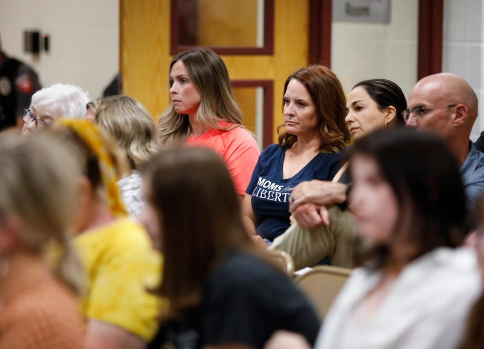 Megan Patrick, center, is chair of the Greene County chapter of Moms for Liberty. At the Nixa school board meeting June 20, she is seated with Lizzie Nothum, vice chair, and Springfield school board member Maryam Mohammadkhani.