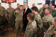 U.S. President Donald Trump and First Lady Melania Trump greet military personnel at the dining facility during an unannounced visit to Al Asad Air Base, Iraq December 26, 2018. REUTERS/Jonathan Ernst