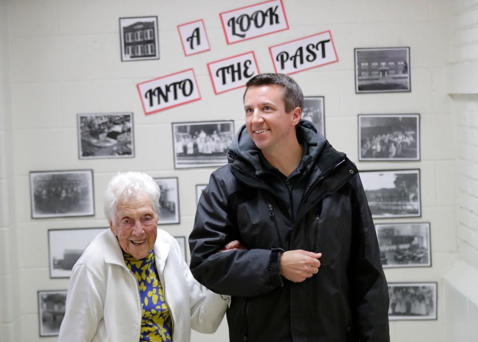 Arline Dabill and her grandson David Bayer are all smiles after looking at photographs from the past during an open house at Roosevelt Elementary School in Neenah on March 19. Dabill, who is 98 years, has lived across the street from the school for 63 years; students refer to her as "Grandma Arline." John Bergstrom, CEO of Bergstrom Automotive, purchased the school for $1 million and is donating it to ThedaCare Regional Medical Center-Neenah. Dan Powers/USA TODAY NETWORK-Wisconsin.