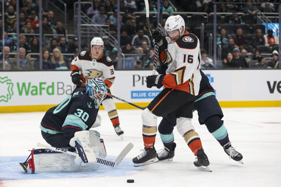 Seattle Kraken goaltender Martin Jones (30) makes a save as Anaheim Ducks center Ryan Strome (16) tried to score during the second period of an NHL hockey game Thursday, March 30, 2023, in Seattle. (AP Photo/Jason Redmond)