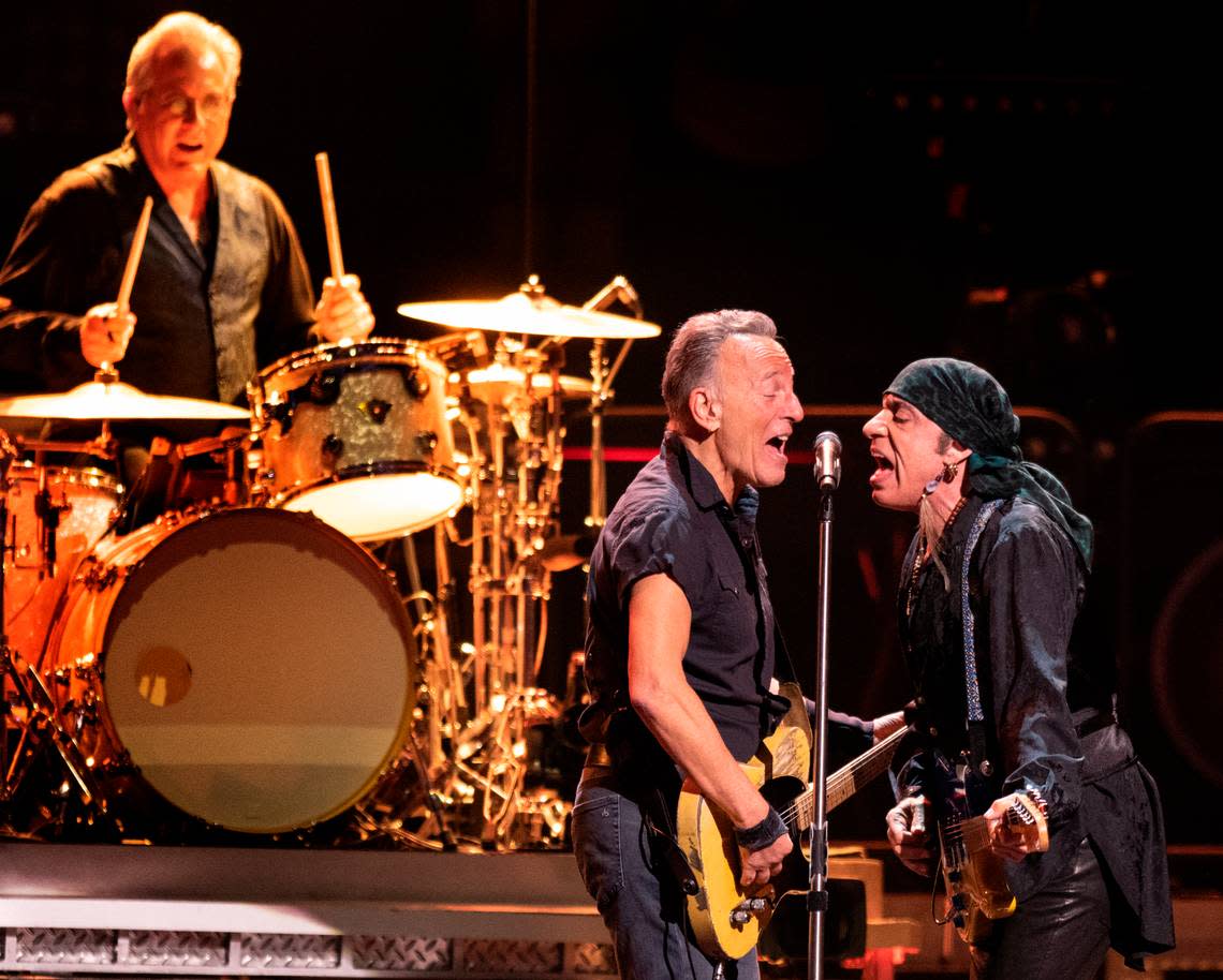 Bruce Springsteen and Steven Van Zand meet at the mic as drummer Max Weinberg pounds the skins on “No Surrender” at the Greensboro Coliseum Saturday night, March 25, 2023.