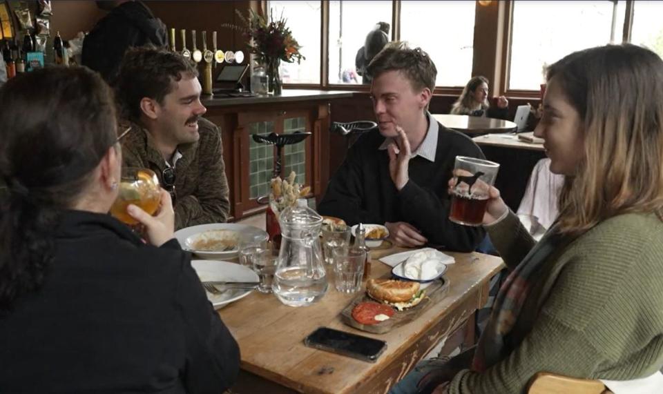 Taylor Swift fans enjoy a pint at The Black Dog pub, in London, England, April 24, 2024. / Credit: CBS News/Duarte Dias