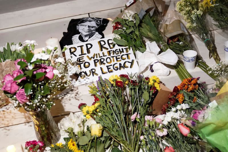 People gather to mourn the death of Associate Justice Ruth Bader Ginsburg at the Supreme Court in Washington