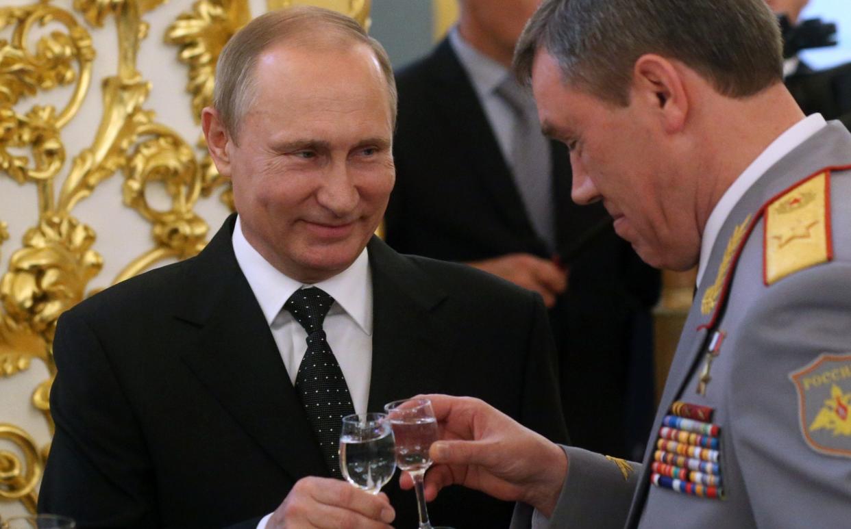 Russian President Vladimir Putin, pictured in 2016 with Valery Gerasimov, Deputy Defence Minister, is not known to be a heavy drinker - Mikhail Svetlov/Getty Images Europe