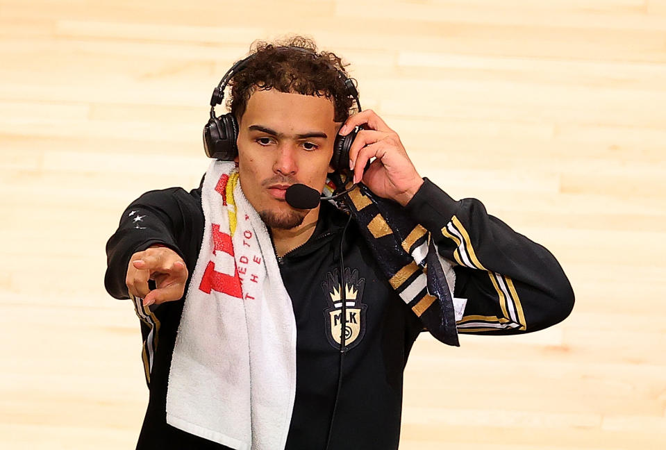 ATLANTA, GEORGIA - MAY 30:  Trae Young #11 of the Atlanta Hawks reacts prior to an interview after their 113-96 win over the New York Knicks in game four of the Eastern Conference Quarterfinals at State Farm Arena on May 30, 2021 in Atlanta, Georgia.  NOTE TO USER: User expressly acknowledges and agrees that, by downloading and or using this photograph, User is consenting to the terms and conditions of the Getty Images License Agreement.  (Photo by Kevin C. Cox/Getty Images)