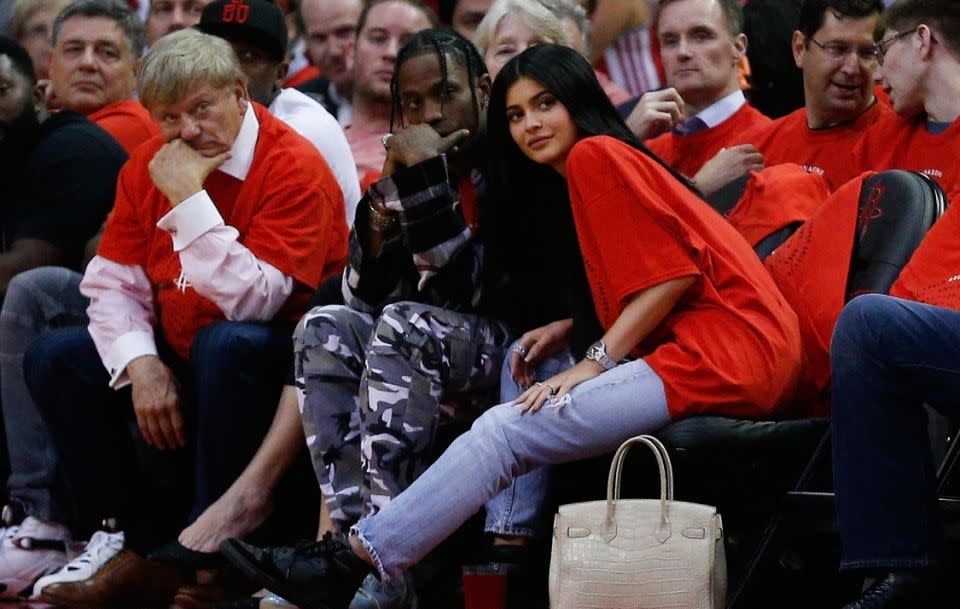 The rapper is said to be excited to become a dad. The couple have only been dating since April. Here they are pictured attending a basketball game together earlier this year. Source: Getty
