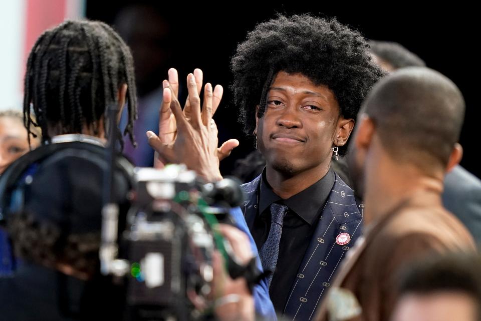 Jalen Williams is congratulated by family and friends after being selected 12th overall by the Oklahoma City Thunder in the NBA basketball draft, Thursday, June 23, 2022, in New York. (AP Photo/John Minchillo)