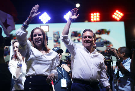 Presidential candidate Laurentino Cortizo of the Democratic Revolutionary Party (PRD) and his wife Yazmin Colon wave as they celebrate after Panama's electoral tribunal declared him as the winner of Sunday's election with 95 percent of votes counted, in Panama City, Panama May 5, 2019. REUTERS/Jose Cabezas