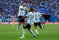 <p>Gabriel Mercado celebrates with Lionel Messi after deflecting in the Argentina legend’s shot past Hugo Lloris to make it 2-1 early in the second half </p>