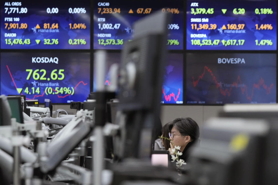 A currency trader watches monitors at the foreign exchange dealing room of the KEB Hana Bank headquarters in Seoul, South Korea, Monday, Feb. 6, 2023. Asian stock markets sank Monday after strong U.S. jobs data fanned fears of more interest rate hikes to cool inflation.(AP Photo/Ahn Young-joon)