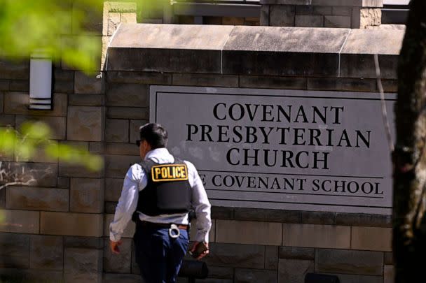 PHOTO: A police officer walks by an entrance to The Covenant School after a shooting in Nashville, Tenn., March 27, 2023. (John Amis/AP)