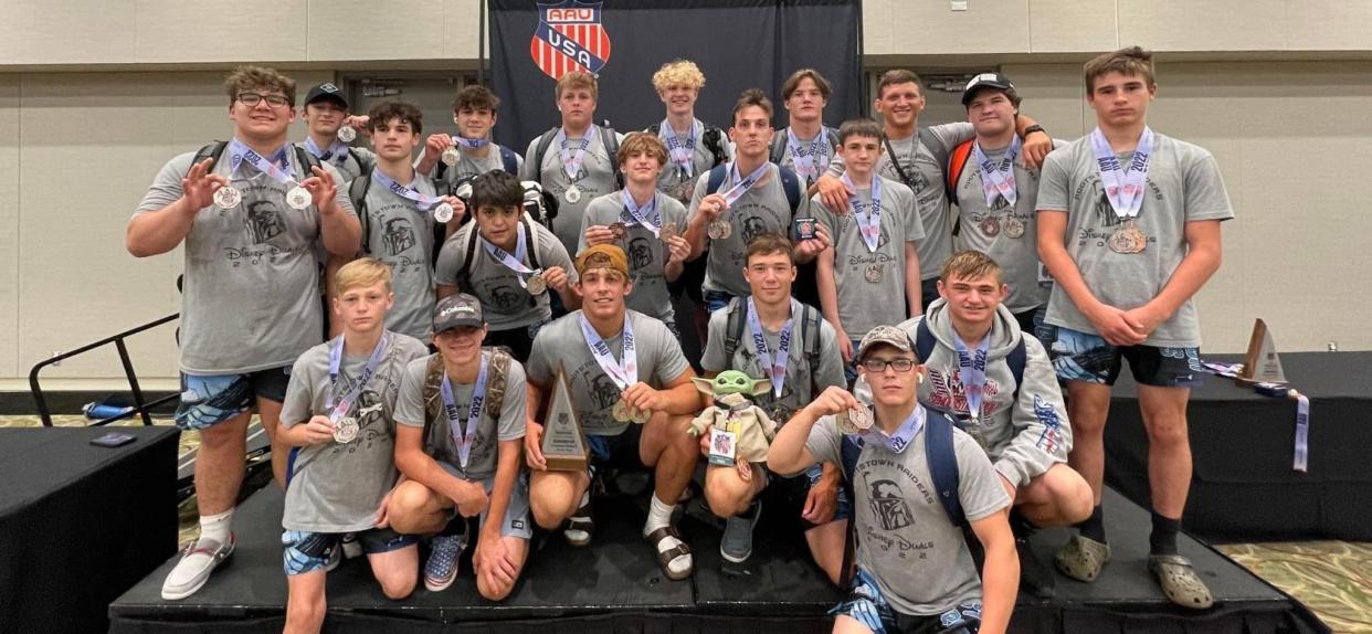 Rootstown wrestling poses for a photo after capturing second at the prestigious Disney Duals.