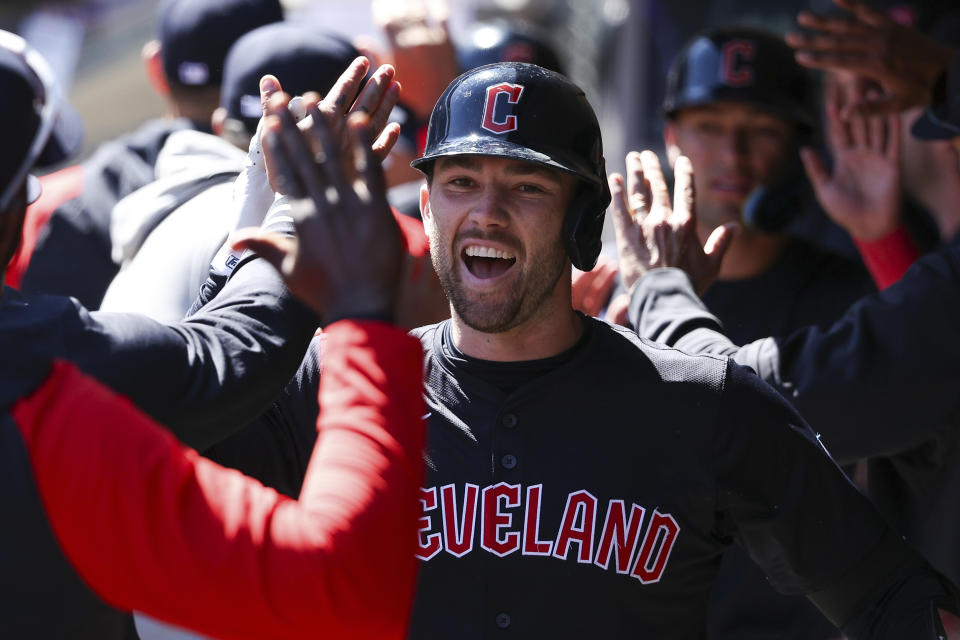 Cleveland Guardians' David Fry is congratulated on his three-run home run against the Minnesota Twins during the second inning of a baseball game, Saturday, April 6, 2024, in Minneapolis. (AP Photo/Matt Krohn)