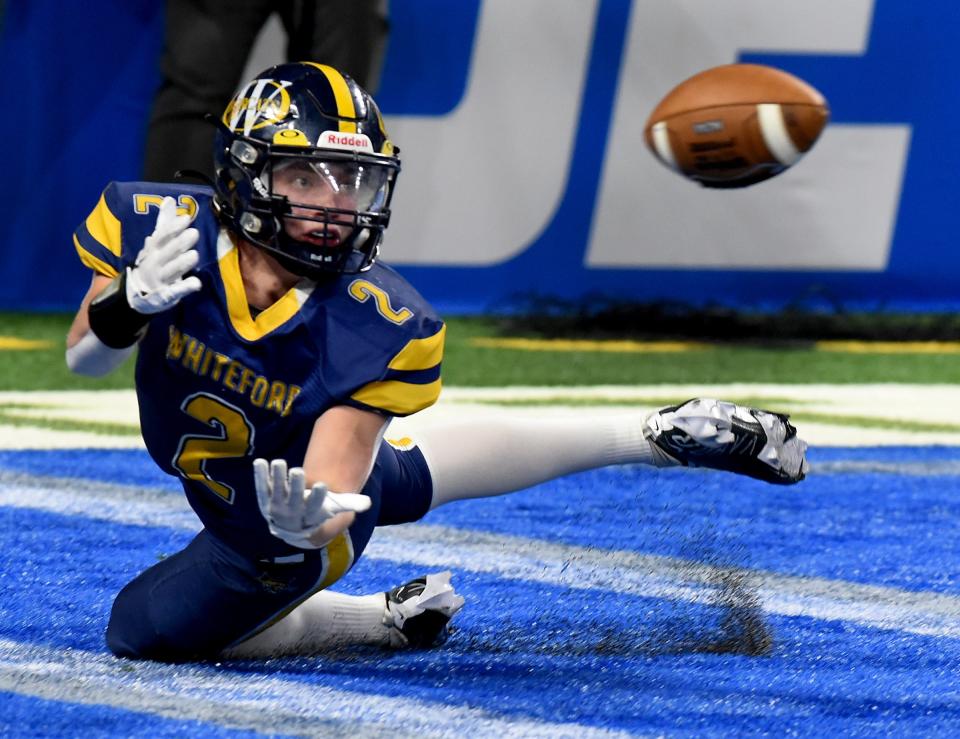 Ryin Ruddy of Whiteford dives for the ball in the first quarter in the end zone, only for the ground to caused an incompletion against Ubly. Whiteford beat Ubly 26-20 in the Division 8 State Championships at Ford Field Friday.