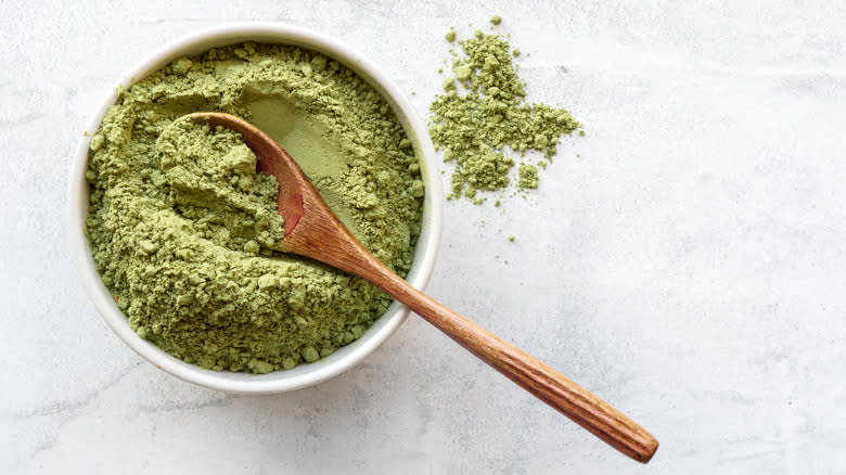 Matcha powder with wooden spoon
