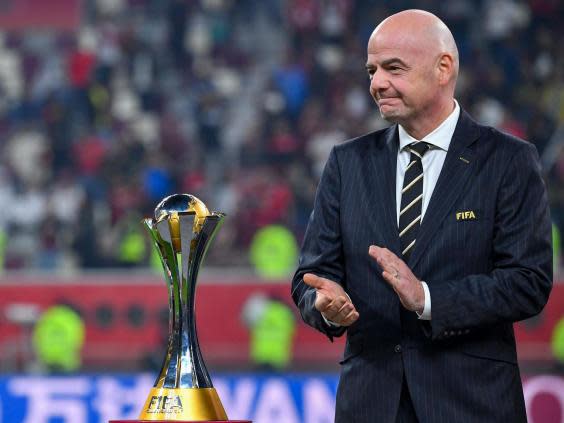 Fifa president Gianni Infantino presents the Club World Cup trophy (Getty)