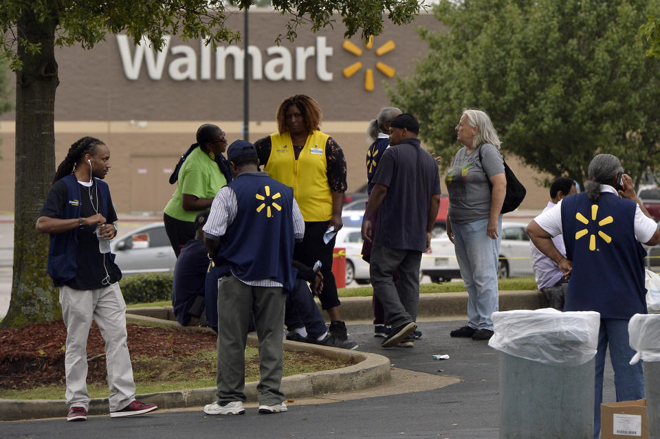 Employees gather in a nearby parking lot after a shooting at a Walmart store Tuesday, July 30, 2019 in Southaven, Miss. (Photo: Brandon Dill/AP)