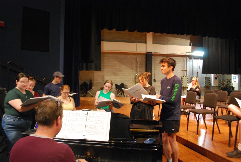 Cast members of "Rocky Mountain High" rehearse for the show that will be at Wharton Center Sept. 15 and Sept. 17.