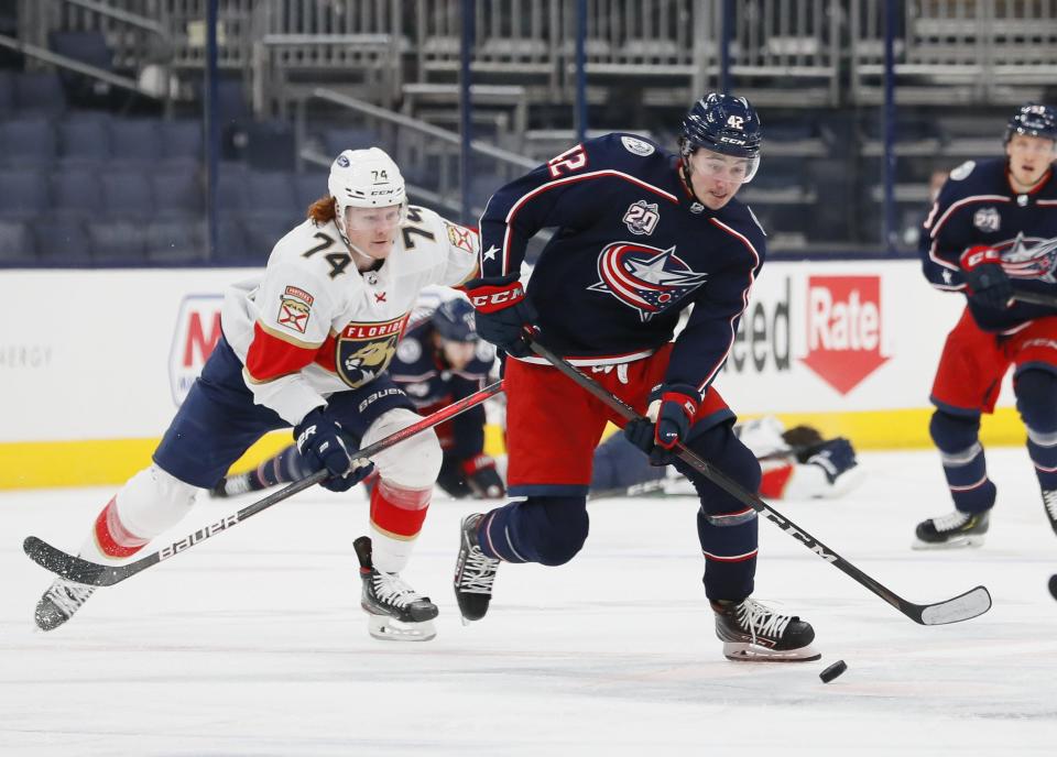 Columbus Blue Jackets center Alexandre Texier (42) races ahead of Florida Panthers right wing Owen Tippett (74) during the third period of the NHL hockey game at Nationwide Arena in Columbus on Thursday, March 11, 2021. The Blue Jackets lost 5-4.