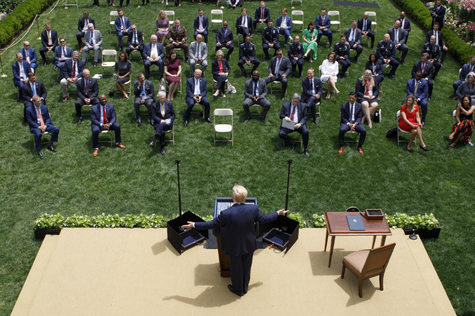 FILE - In this June 16, 2020, file photo President Donald Trump speaks during an event on police reform, in the Rose Garden of the White House in Washington. Americans are deeply unhappy about the state of their country, and a majority think Trump is doing more to divide the nation than unite it, according to a new poll from The Associated Press-NORC Center for Public Affairs Research. (AP Photo/Evan Vucci, File)