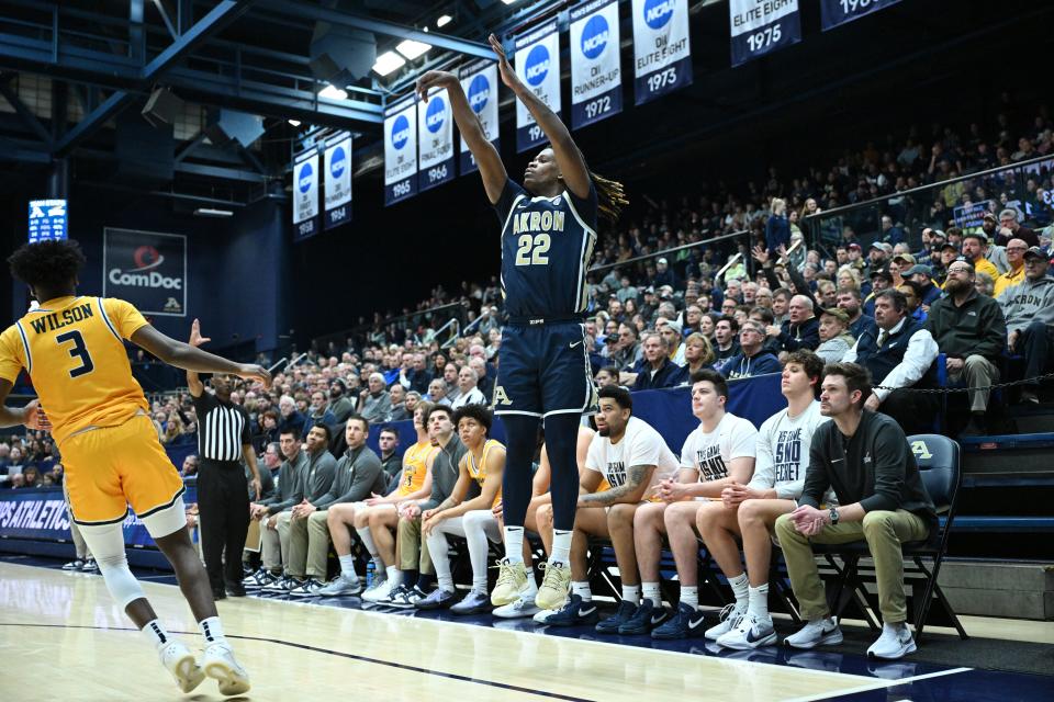 Akron guard Mikal Dawson shoots a 3-pointer Friday against Toledo in Akron.