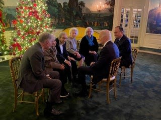 Saul Dreier, center left, met with President Joe Biden along with a group of fellow Holocaust survivors in December. Dreier asked to play the drums with the U.S. Marine Band, a request the band accommodated.