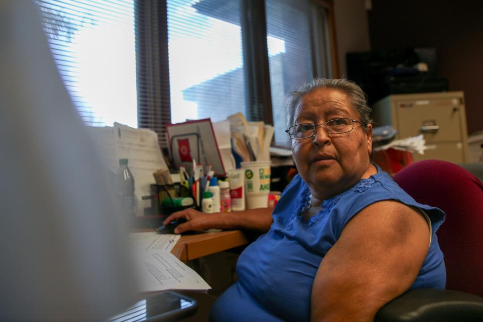 Juanita Scherich, ICWA supervisor for the Oglala Sioux Tribe, responds to emails in her office in Pine Ridge on Wednesday, Aug. 23, 2023.